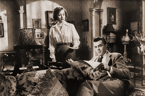 Margaret Lockwood (as Freda Jeffries) and Dirk Bogarde (as Edward Bare) in a photograph from Cast a Dark Shadow (1955) (21)