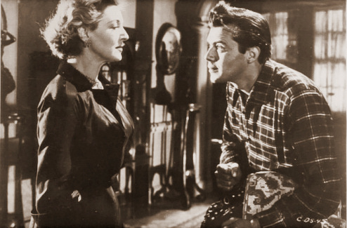 Kay Walsh (as Charlotte Young) and Dirk Bogarde (as Edward Bare) in a photograph from Cast a Dark Shadow (1955) (29)
