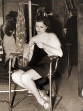 Margaret Lockwood knits away the time during a break from filming A Girl Must Live