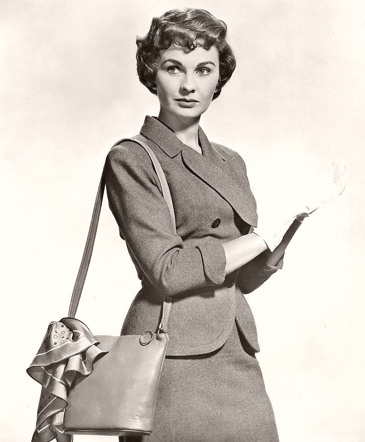 Jean Simmons as Sergeant Sarah Brown wears white gloves in a publicity shot for the film Guys and Dolls, from 1955.  