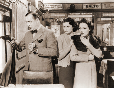 Basil Radford (as Charters), Margaret Lockwood (as Iris Matilda Henderson) and Linden Travers (as Mrs Margaret Todhunter) in a photograph from The Lady Vanishes (1938) (19)