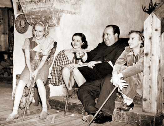 Sally Stewart (as Julie), Margaret Lockwood (as Iris Matilda Henderson), Alfred Hitchcock and Googie Withers (as Blanche) in a photograph from The Lady Vanishes (1938) (27)