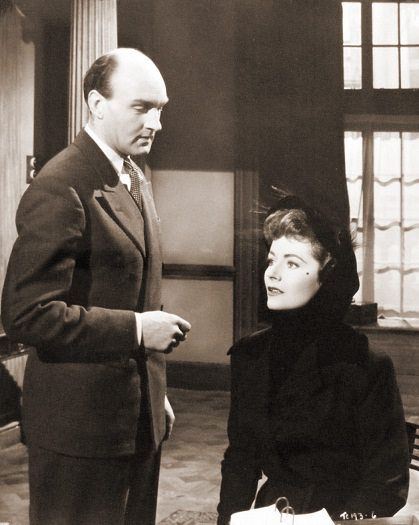 Maurice Denham (as Dr Simon Blake) and Margaret Lockwood (as Lydia Garth) in a photograph from Madness of the Heart (1949) (25)
