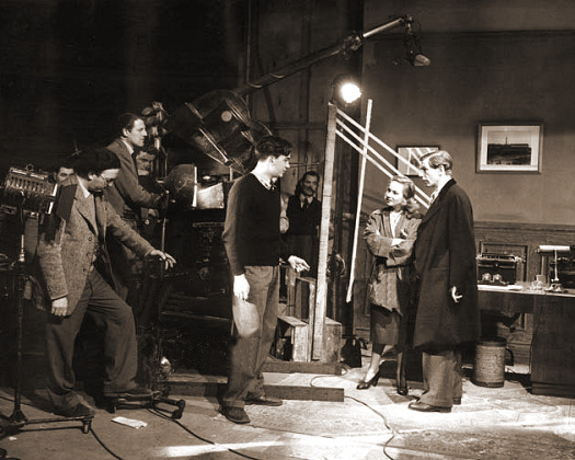 Scottish-American director Alexander Mackendrick (1912-1993) drills actors Joan Greenwood and Michael
Gough for the next scene, during production of ’The Man in the White Suit’ at Ealing Studios