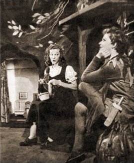 On stage during Peter Pan (1950), Margaret Lockwood (as Peter pan) and Christina Forrest (as Wendy)  enact a scene from the play