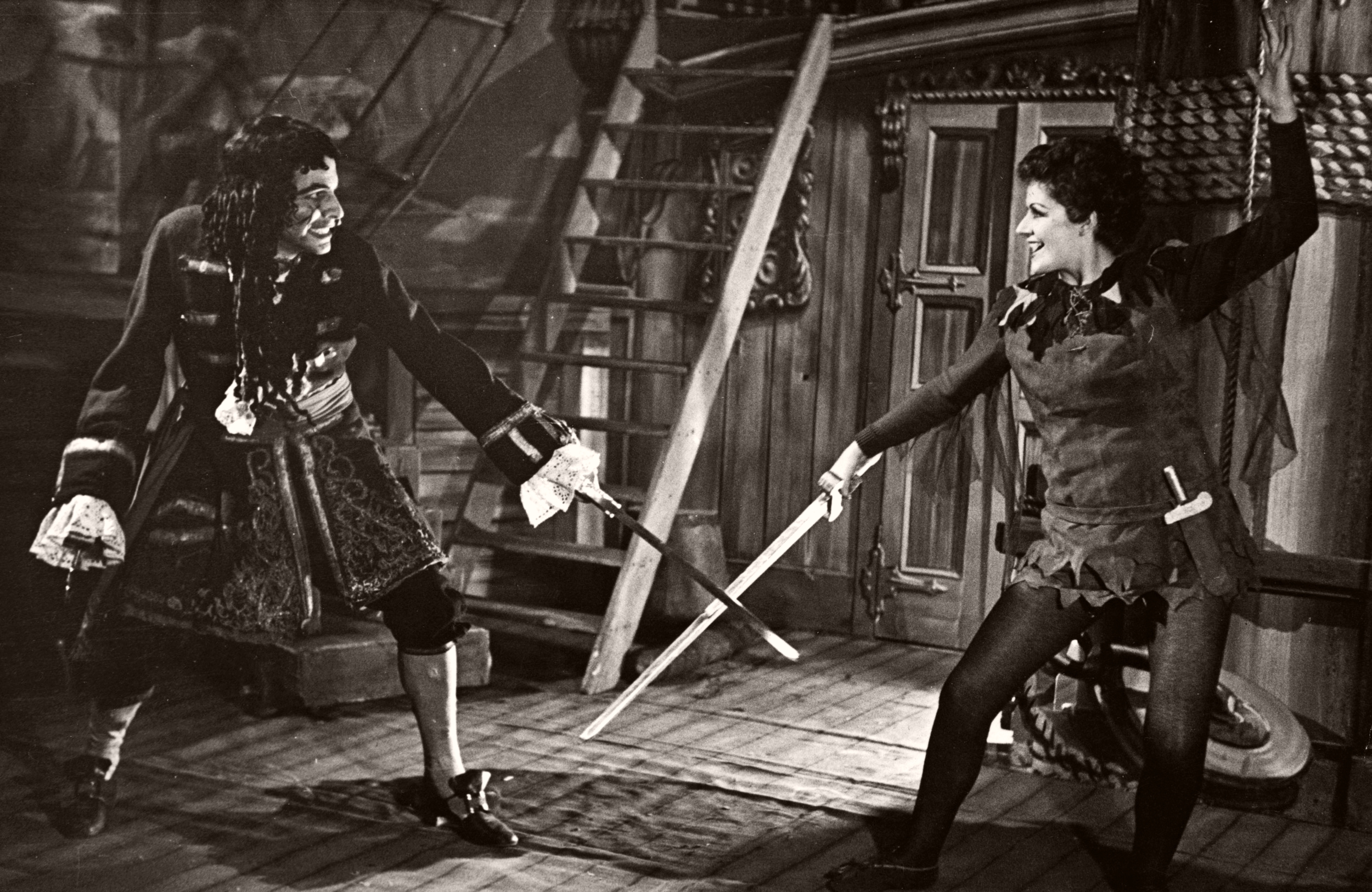 Photograph of John Justin as Capt Hook and Margaret Lockwood as Peter Pan in the Scala Theatre, 1950 production run of Peter Pan
