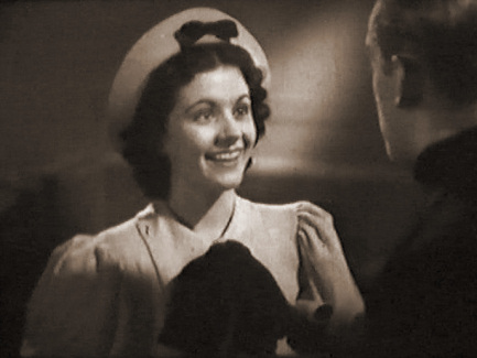 Margaret Lockwood (as Margaret Williams) and Hughie Green (as Hughie Hawkins) in a screenshot from Melody and Romance (1937) (3)