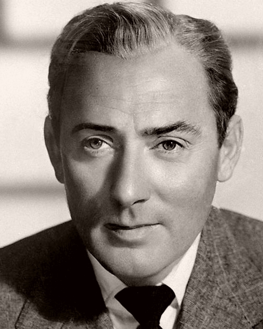 British actor Michael Wilding wears a jacket and tie