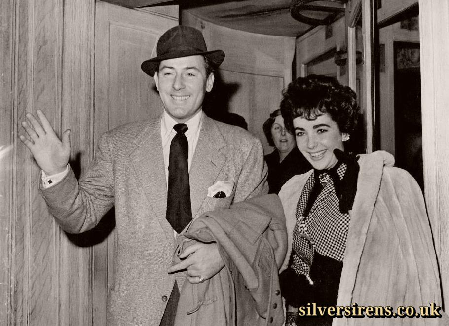 Screen actor Michael Wilding, aged 39, with his actress-bride Elizabeth Taylor, aged 19, leave their London hotel for London Airport.  They are flying to Paris for their honeymoon following their marriage yesterday (Thursday) at Caxton Hall, London.  22nd February, 1952.