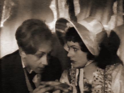 Hughie Green (as Midshipman Easy) and Margaret Lockwood (as Donna Agnes) in a screenshot from Midshipman Easy (1935) (1)