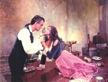 Stewart Granger (as Jeremy Fox) and Viveca Lindfors (as Mrs Minton) in a photograph from Moonfleet (1955) (4)