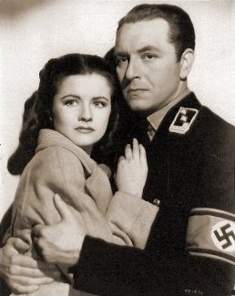 Margaret Lockwood (as Anna Bomasch) and Paul Henreid (as Karl Marsen) in a photograph from Night Train to Munich (1940) (3)