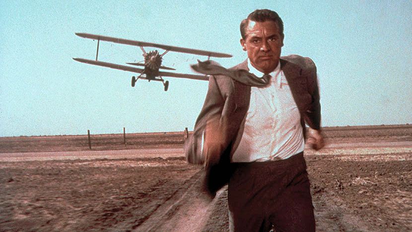 Photograph from North by Northwest (1959). Cary Grant (as Roger Thornhill) flees from a biplane in an iconic scene from the film