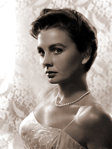 Jean simmons wears a pearl necklace and a lacy top