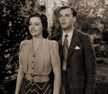 Margaret Lockwood (as Janet Royd) and Derek Farr (as Dallas Chaytor) in a photograph from Quiet Wedding (1941) (2)