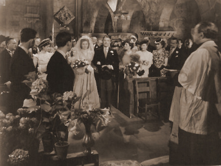 Margaret Lockwood and A E Matthews walk up the aisle as Derek Farr looks on in a photograph from Quiet Wedding
