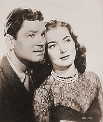 Anthony Steel (as Captain Harry Wilding) and Patricia Roc (as Anne Wilding) in a photograph from Something Money Can’t Buy (1952) (4)