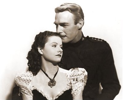 Margaret Lockwood (as Vicky Standing) and Randolph Scott (as Inspector Angus ‘Monty’ Montague) in a photograph from Susannah of the Mounties (1939) (4)