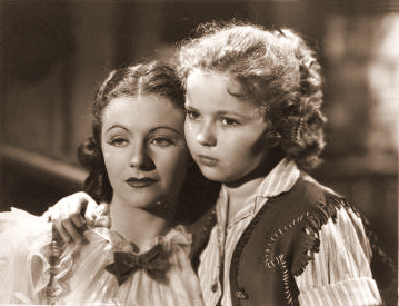 Margaret Lockwood (as Vicky Standing) and Shirley Temple (as Susannah Sheldon) in a photograph from Susannah of the Mounties (1939) (7)