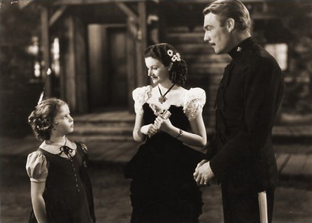Shirley Temple (as Susannah Sheldon), Margaret Lockwood (as Vicky Standing) and Randolph Scott (as Inspector Angus ‘Monty’ Montague) in a photograph from Susannah of the Mounties (1939) (8)