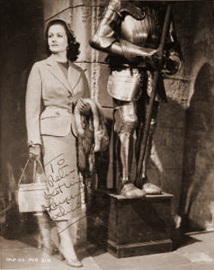 Autographed photo of Margaret Lockwood as Marissa Menzies standing next to a suit of armour in Trouble in the  Glen