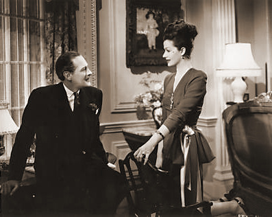 The White Unicorn (1947) photograph (32) Fobey (Guy Middleton) wants Lucy (Margaret Lockwood) to be happy, but realises that there is something missing in her life: she hasn’t enough to keep her occupied. She tells Fobey that the house, the furniture, everything in it belongs to Philip; except for the ghost who haunts the drawing-room waiting for her lover